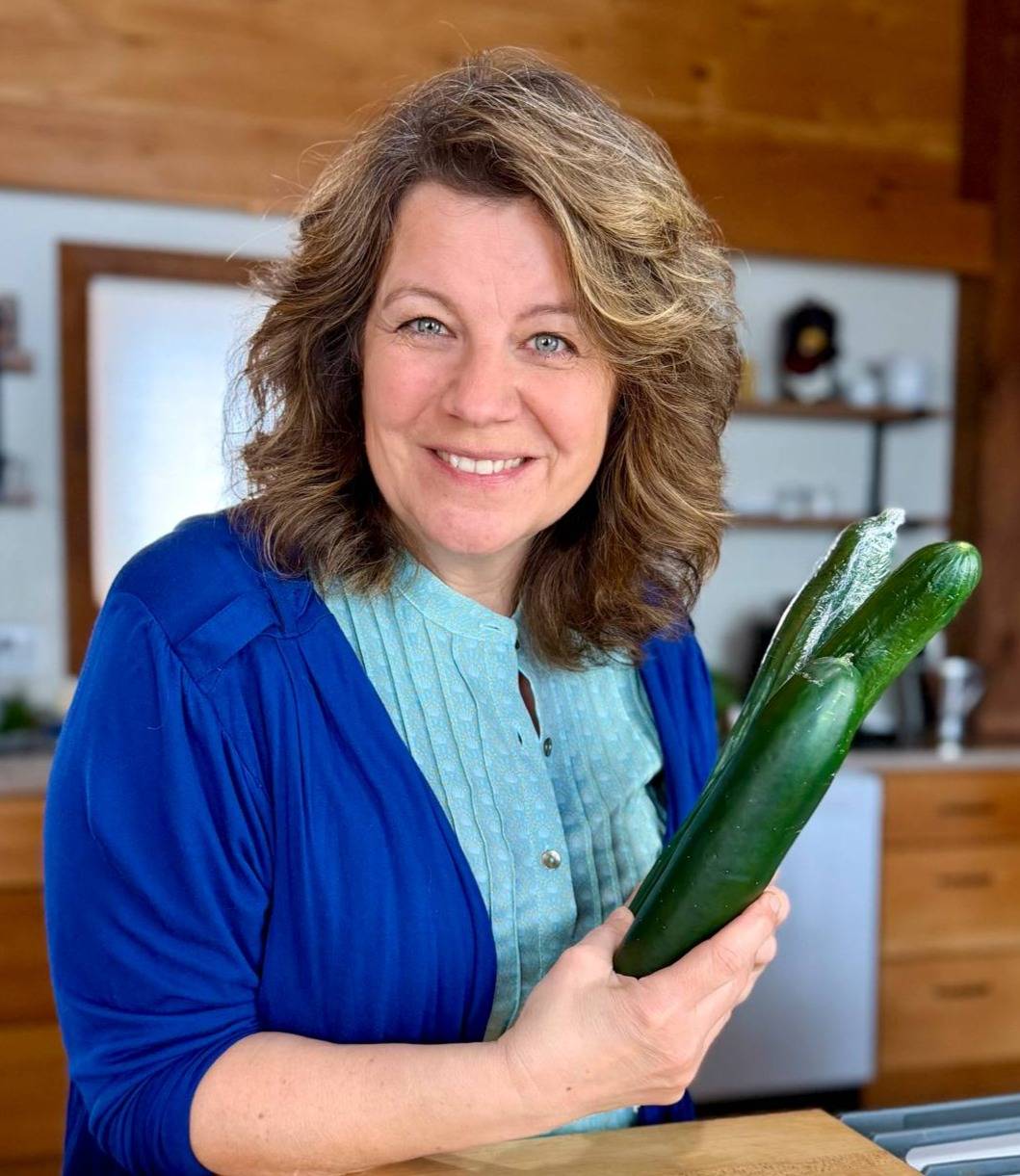 Getty smiling holding cucumbers