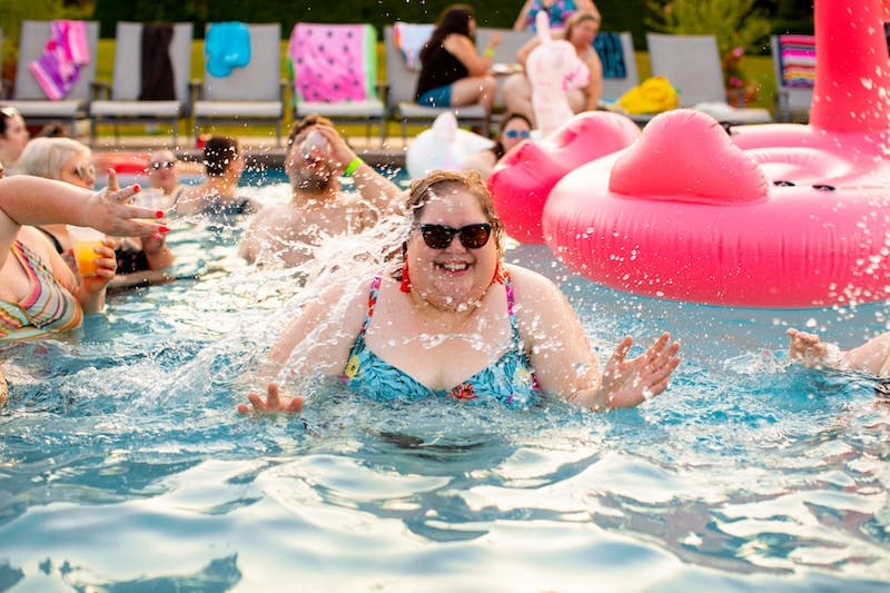 woman wearing black sunglasses on swimming pool