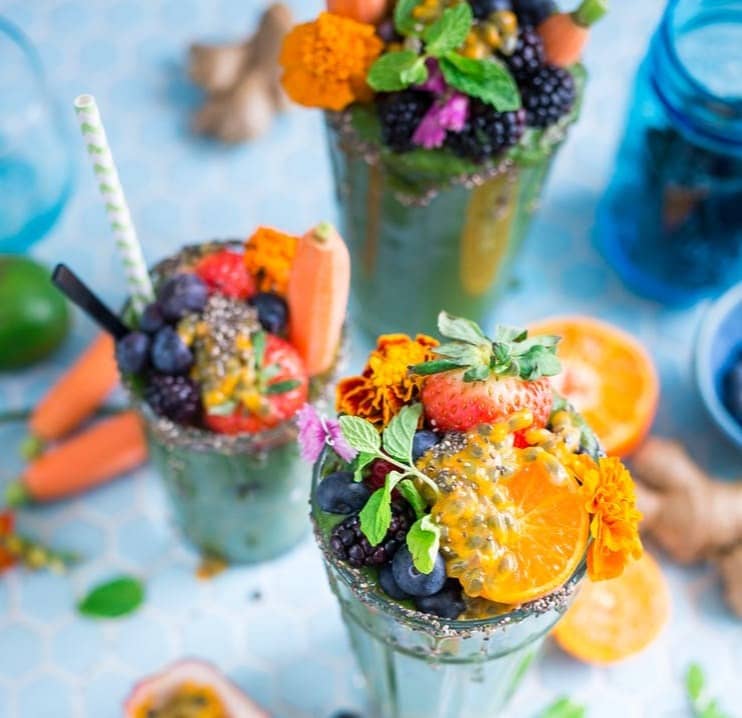 tilt shift lens photography of fruits in drinking glass