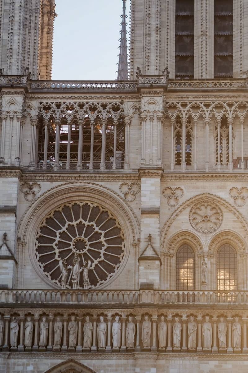 Notre dame cathedral's beautiful facade is shown.