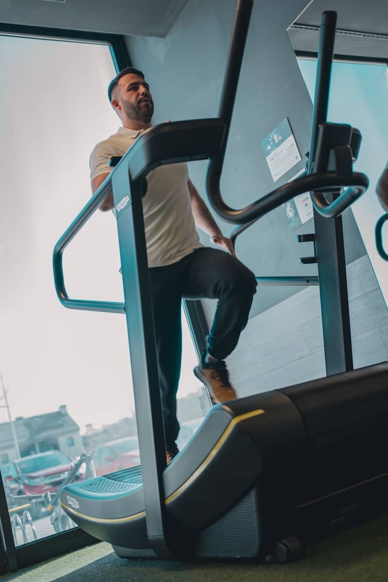 A man is running on a tread machine
