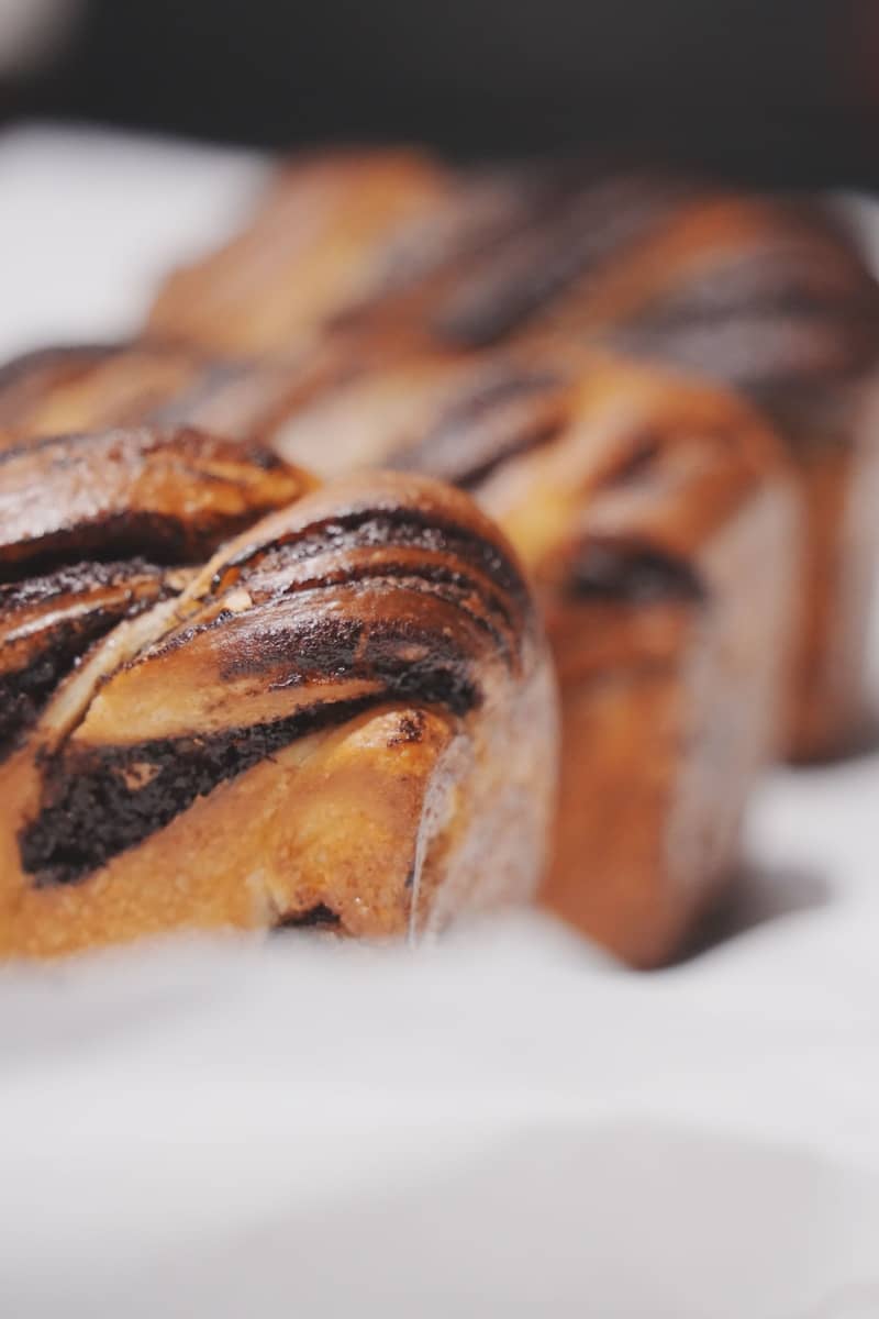 Freshly baked babka loaves are displayed.