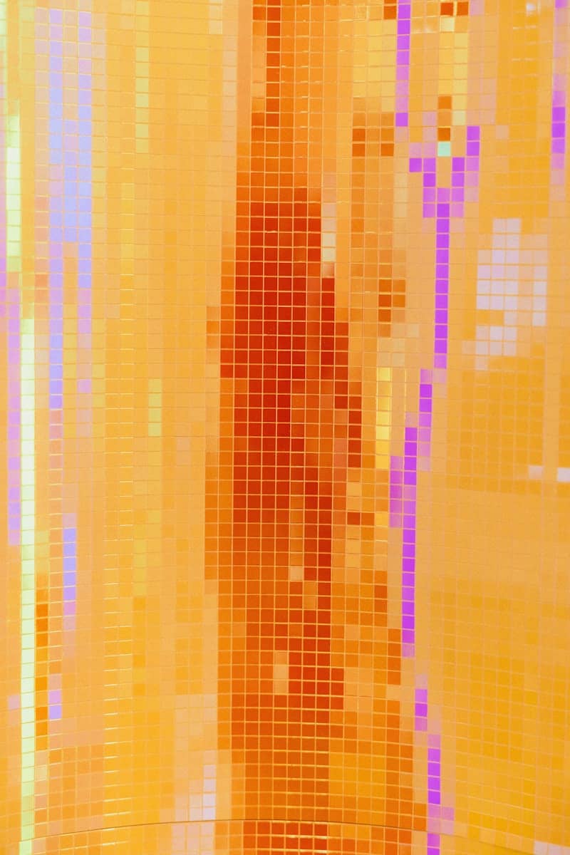 Abstract mosaic pattern features warm colors.