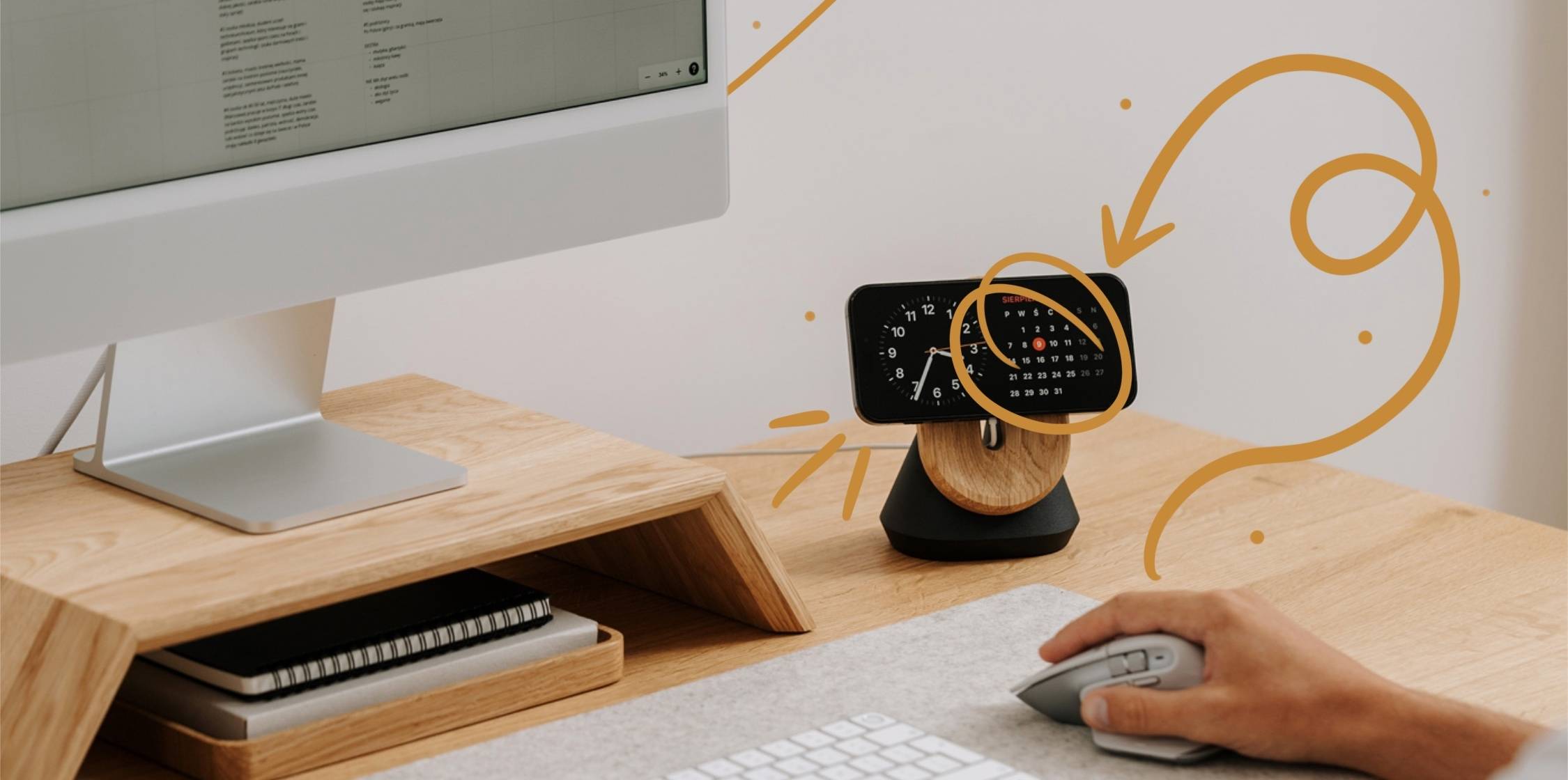 Desk setup with a monitor and phone on a stand
