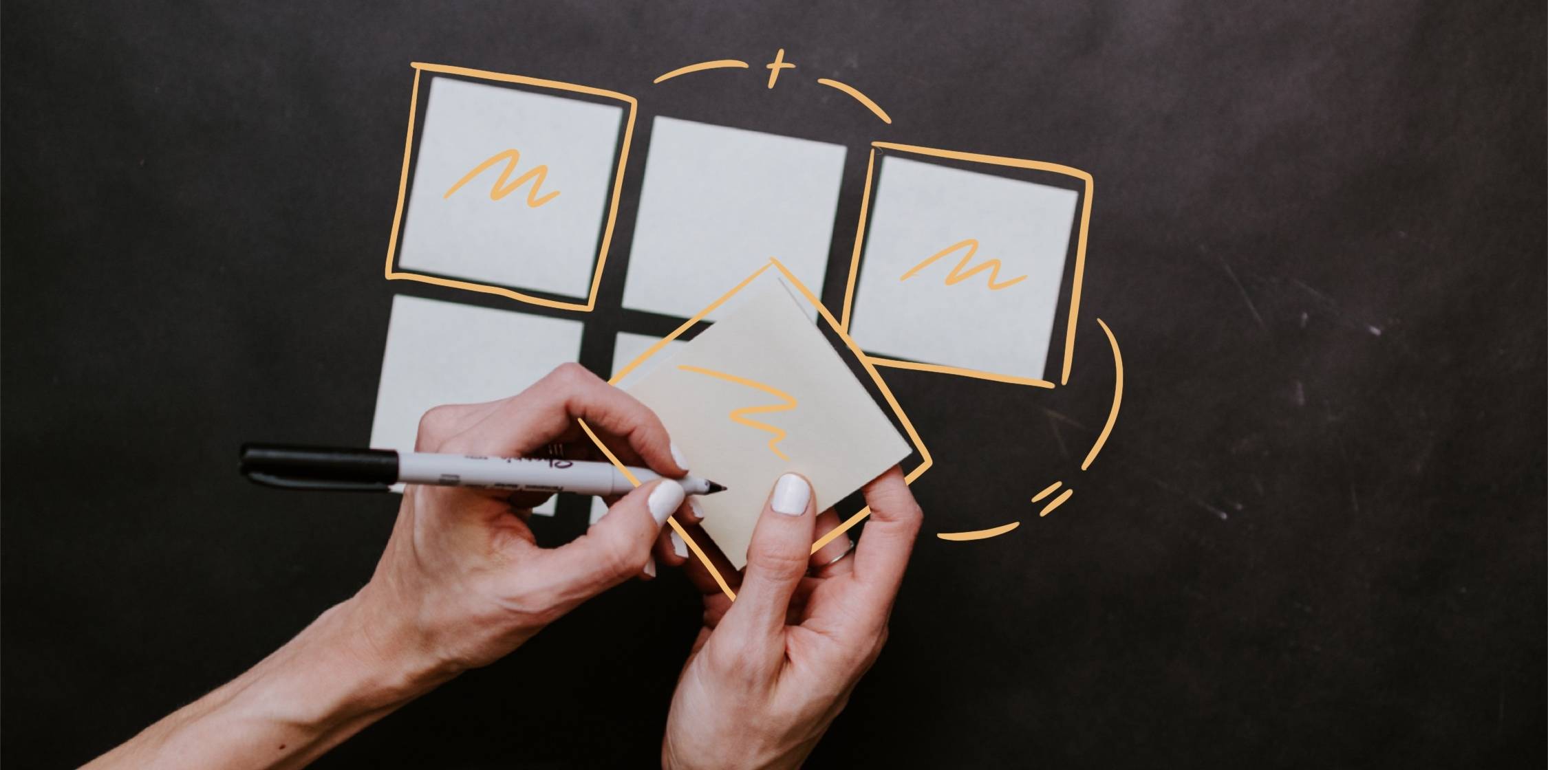 Hands arranging blank sticky notes connected by drawn arrows.