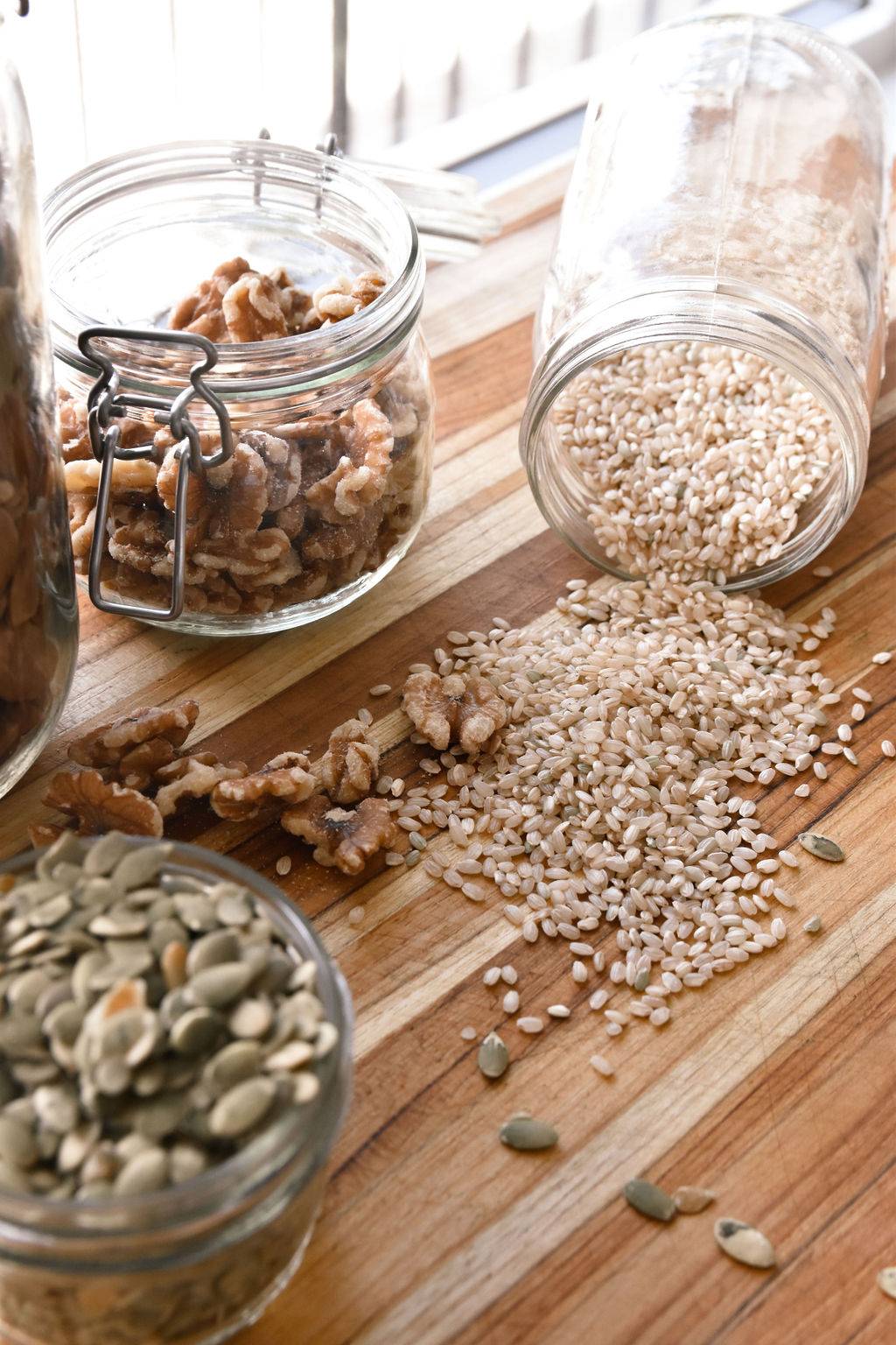 Jars of whole grains, nuts, and seeds