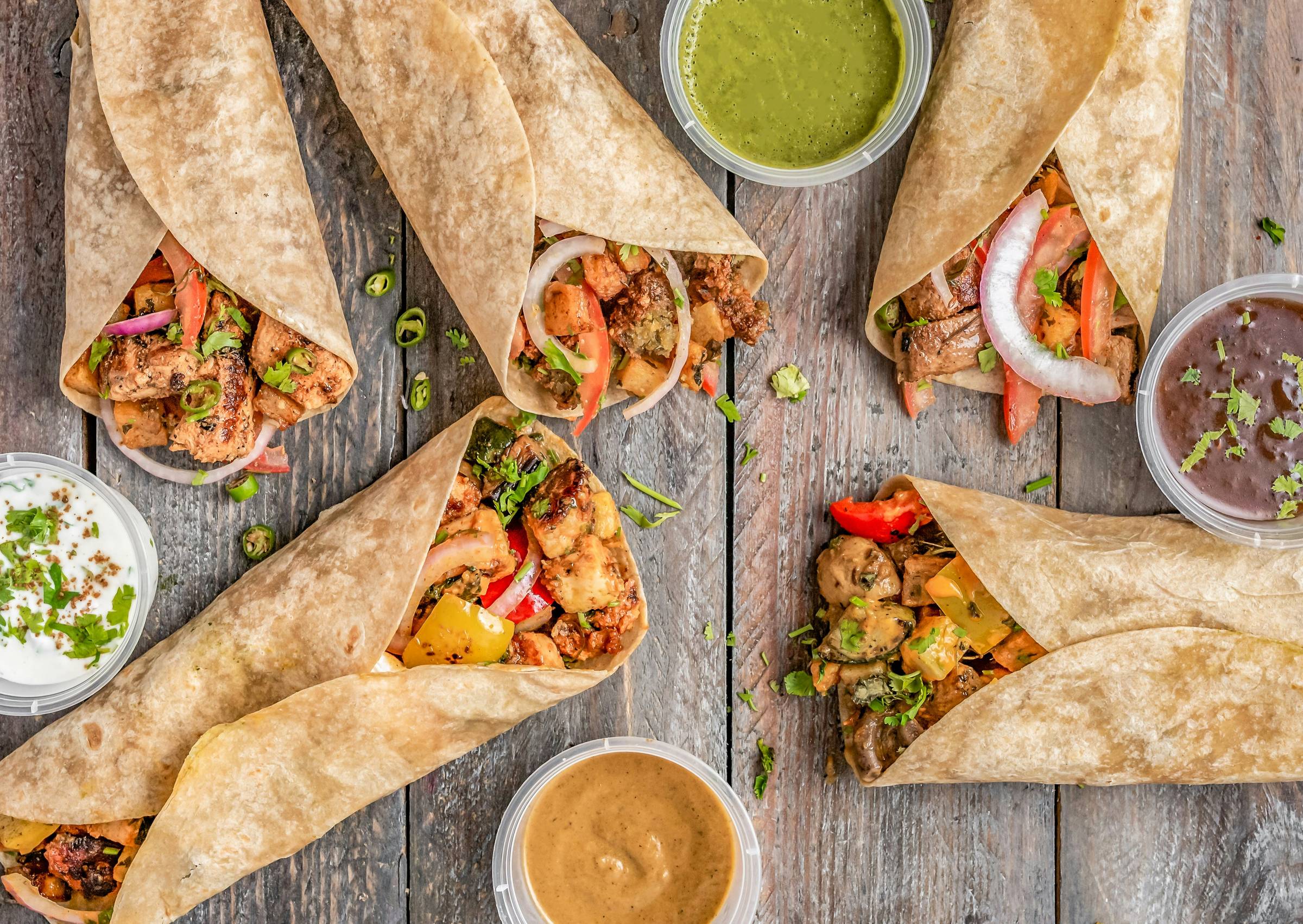 Tacos on wood table, Photo by Ryan Concepcion on Unsplash