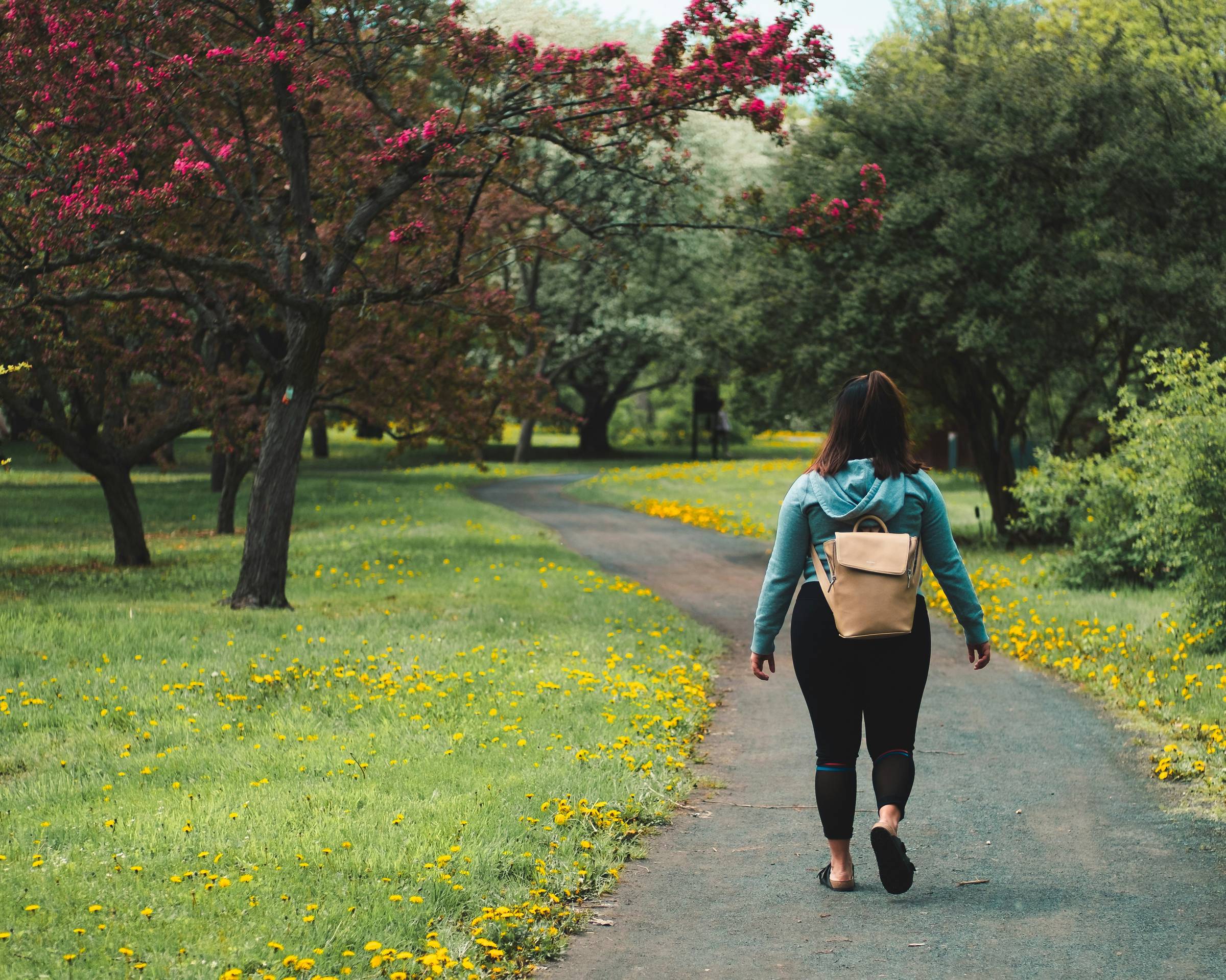 Woman walking Photo by Jeffrey Grospe on Unsplash