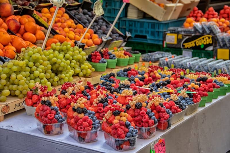 A bunch of fruit that are on a table
