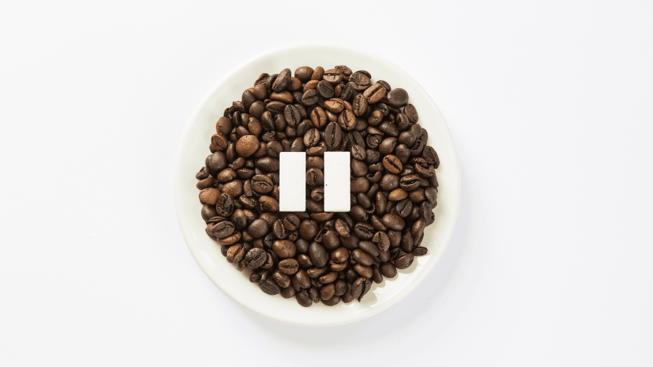 coffee beans in bowl with pause image 