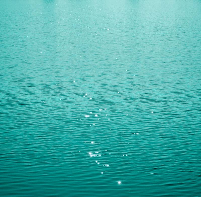 Sparkling turquoise water surface with gentle ripples