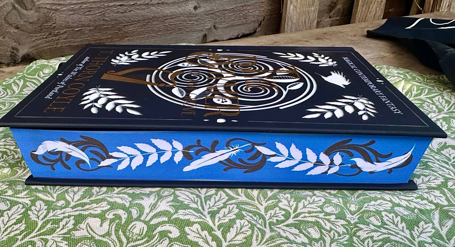 deluxe book edition with gilded title and vivid sprayed edges