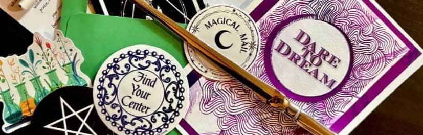 An envelope, a spell letter, stickers, audio, art and a letter opener