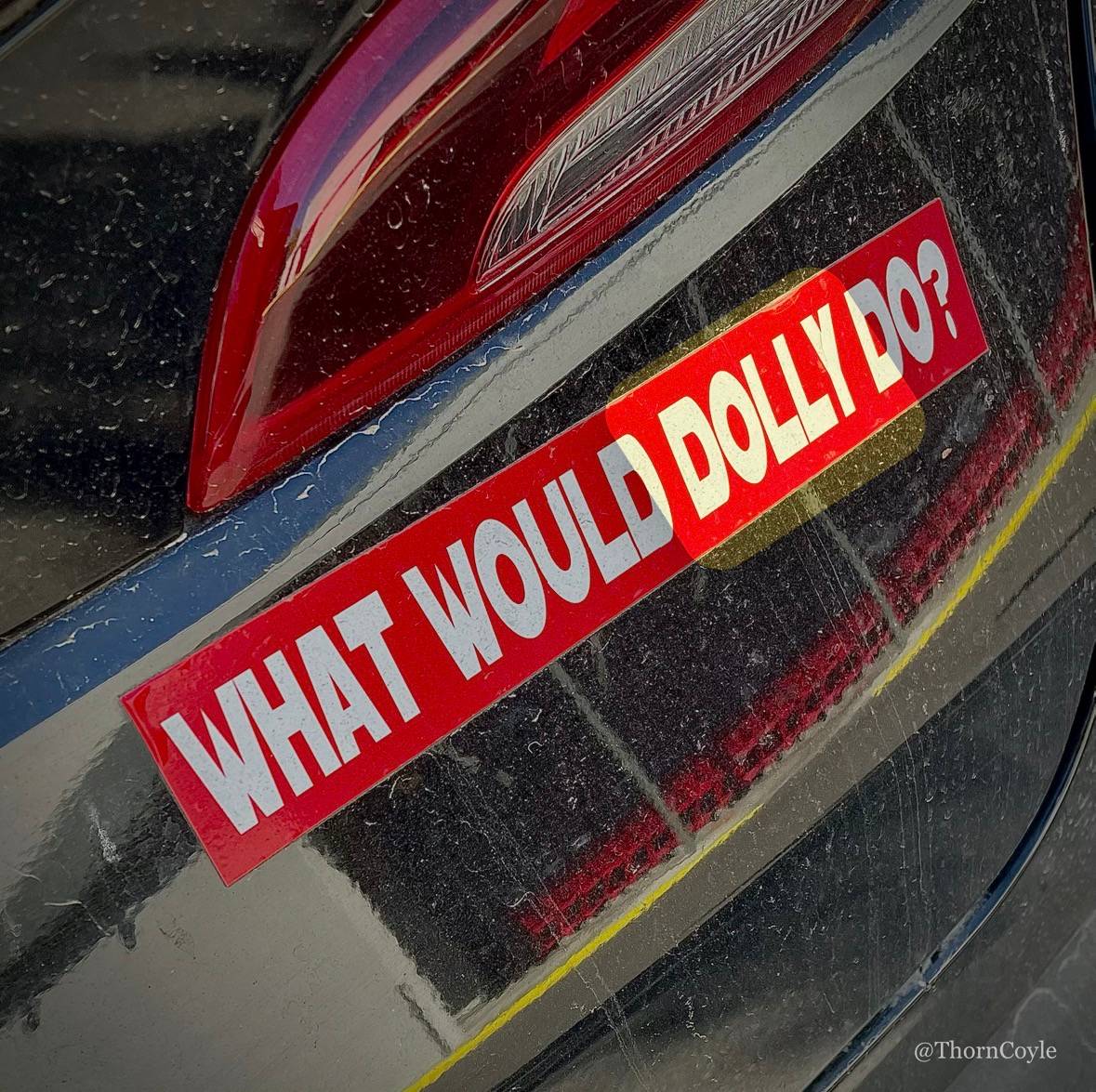 Bumper sticker on a dirty car: what would dolly do?