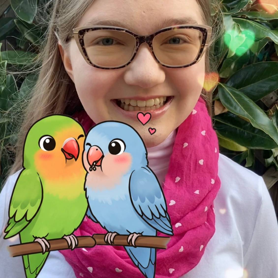 Madeline with two lovebirds