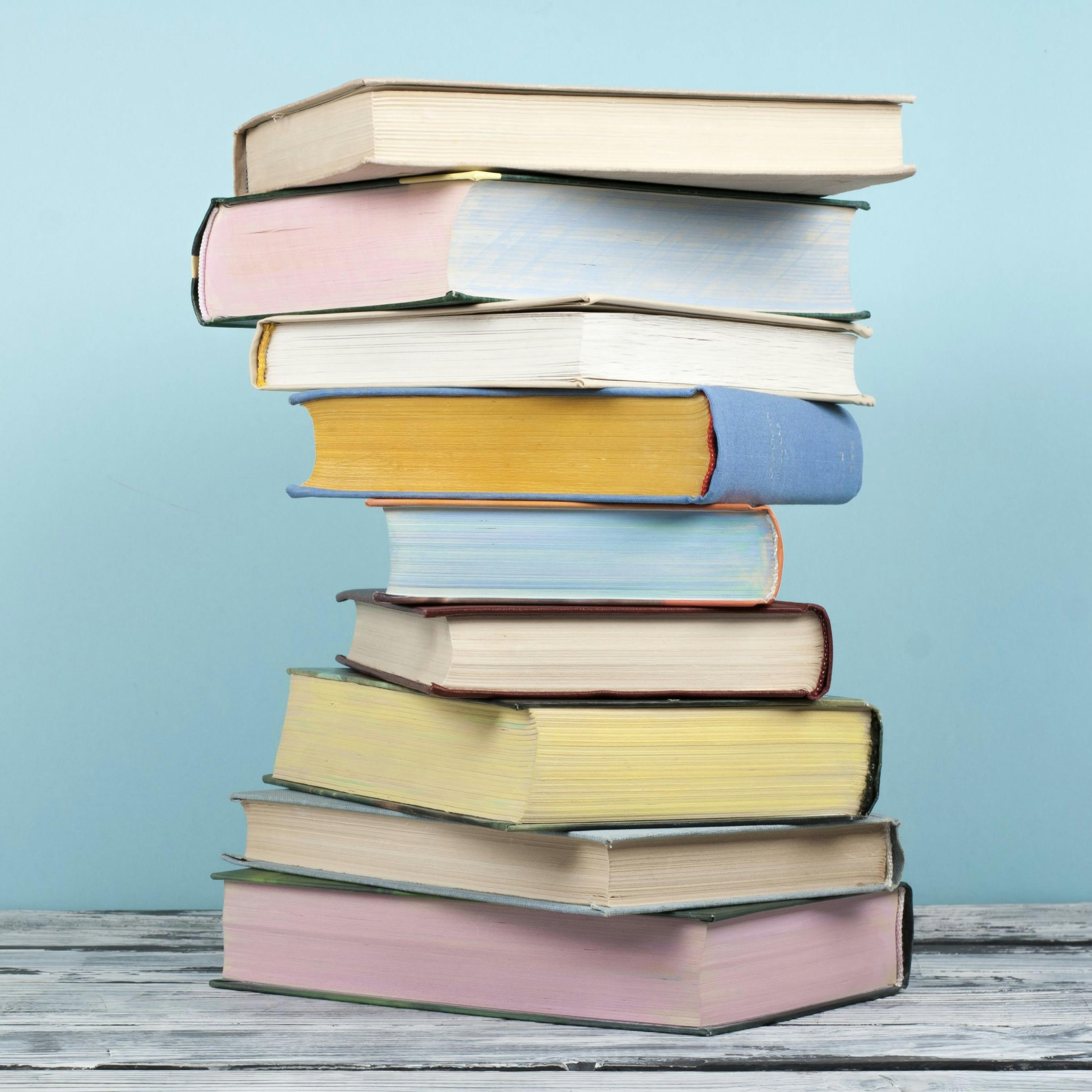 A stack of pastel books