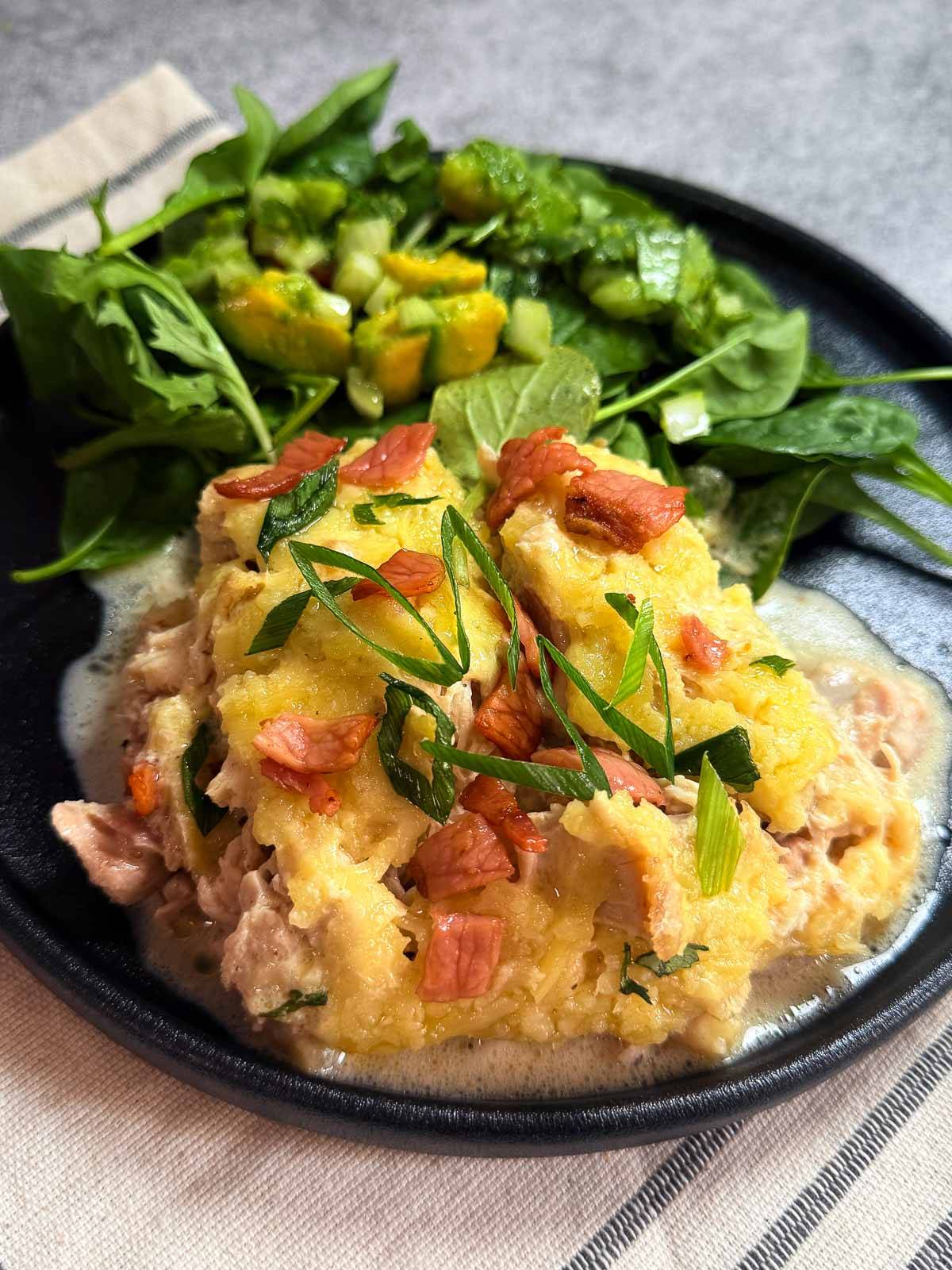 Crack cheese chicken with salad leaves. 