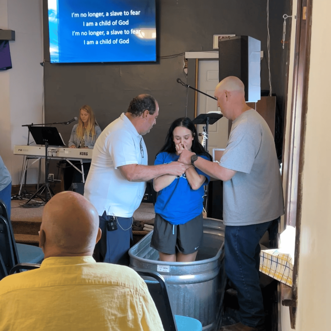 A Student Getting Baptized