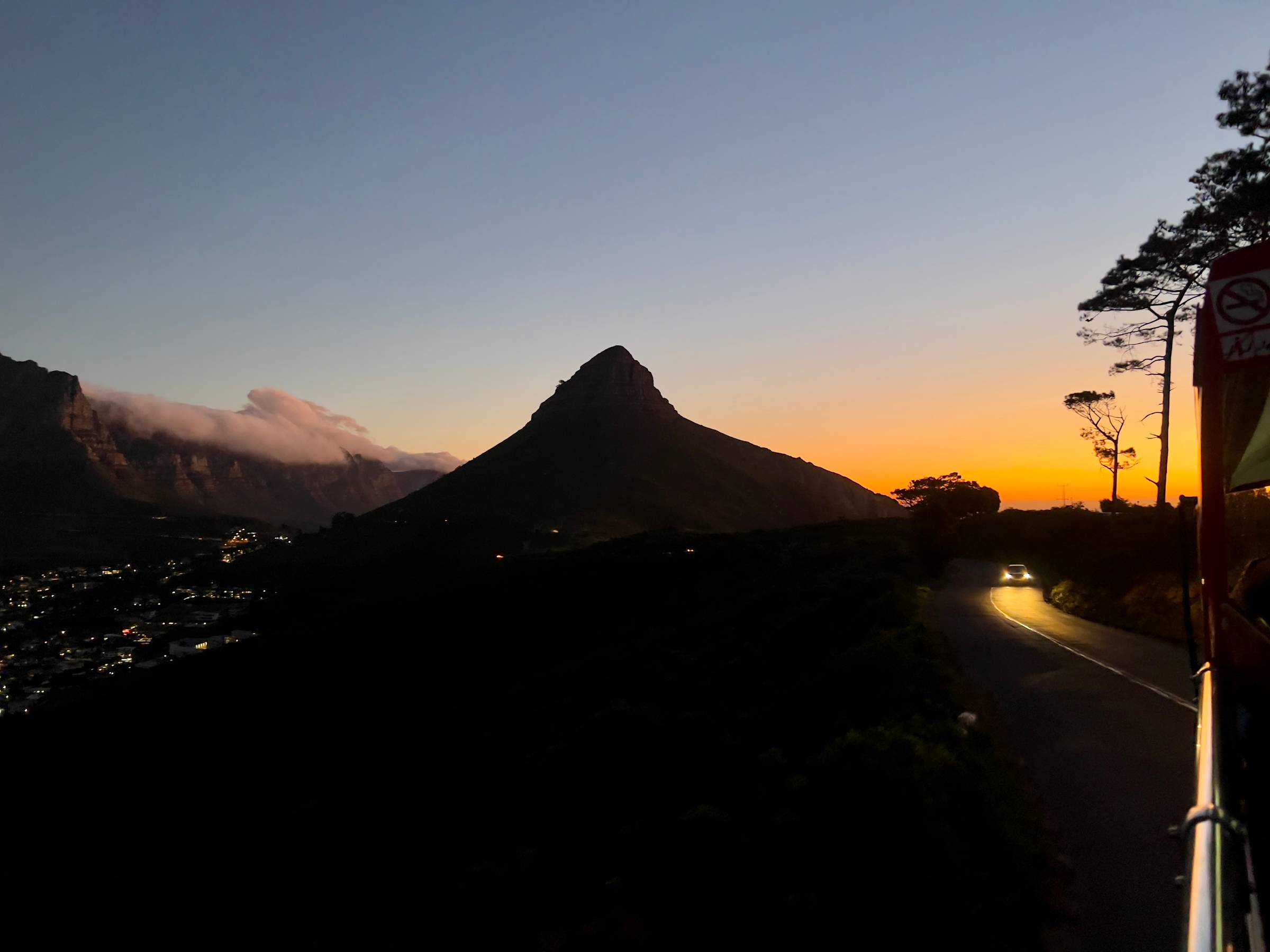 A sunset silhouette of Lion's Head in Cape Town, South Africa