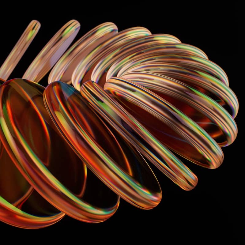A spiraling, glass-like structure against black.