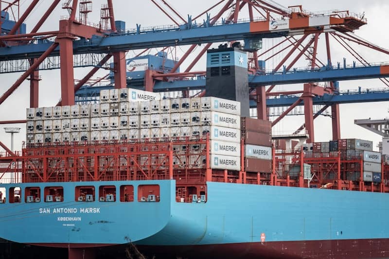 a large blue and red ship in the water