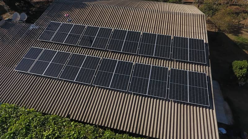 Solar panels are installed on a rooftop.