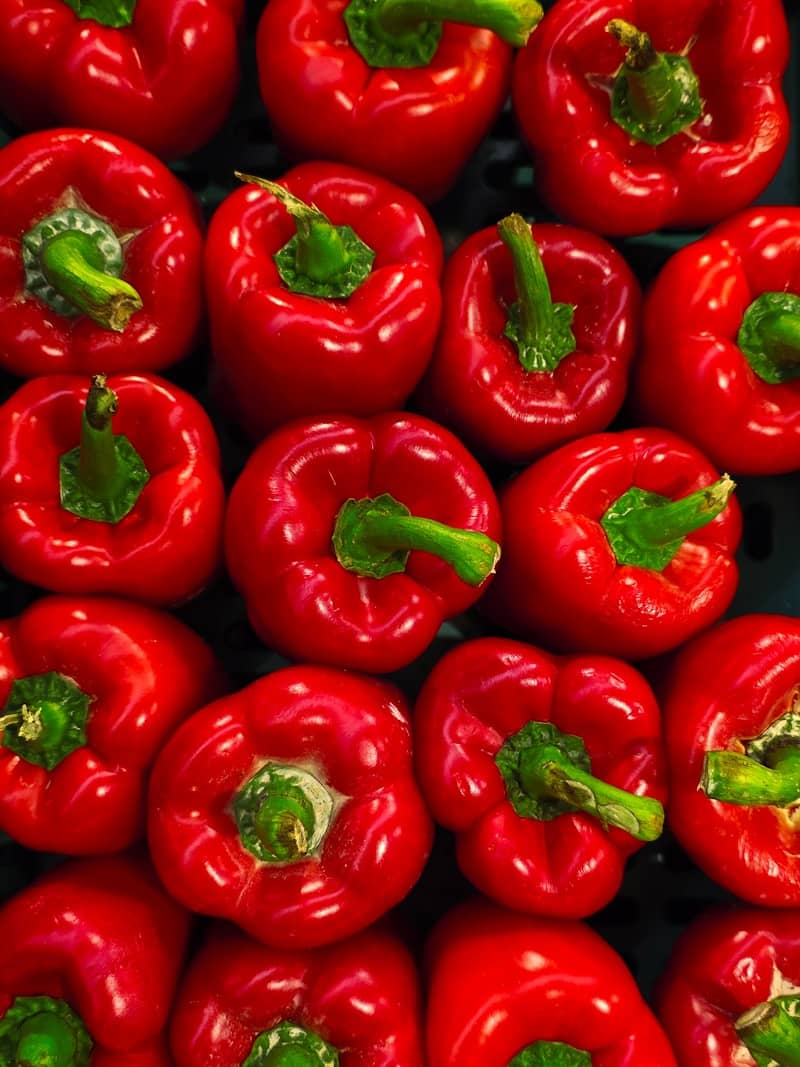 Fresh red bell peppers, ready to eat.