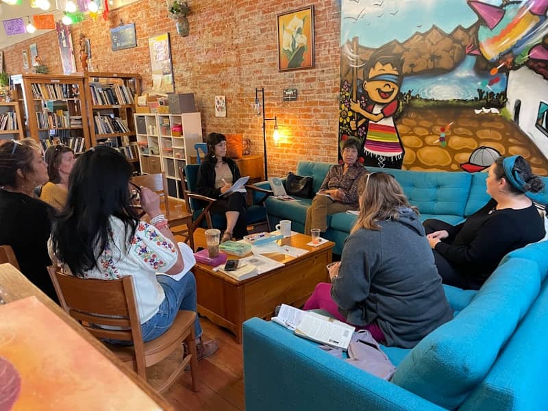 A group of people sitting around a living room