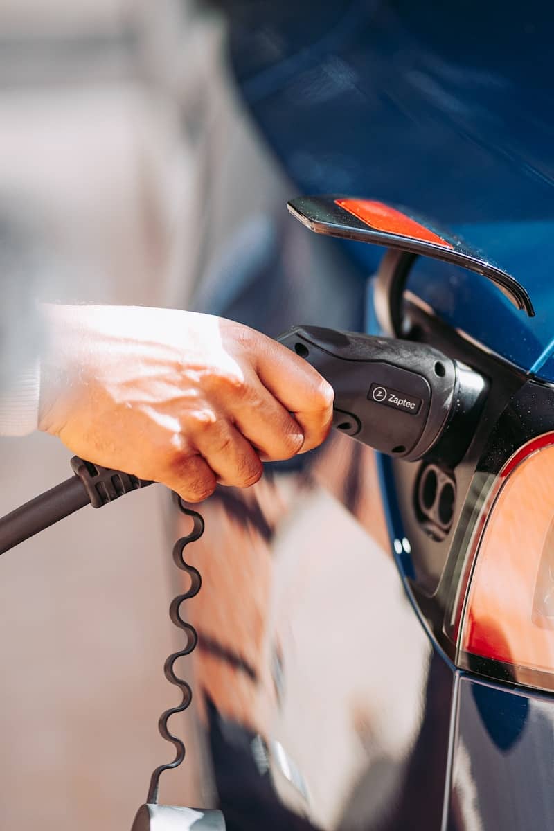 A person charging an EV
