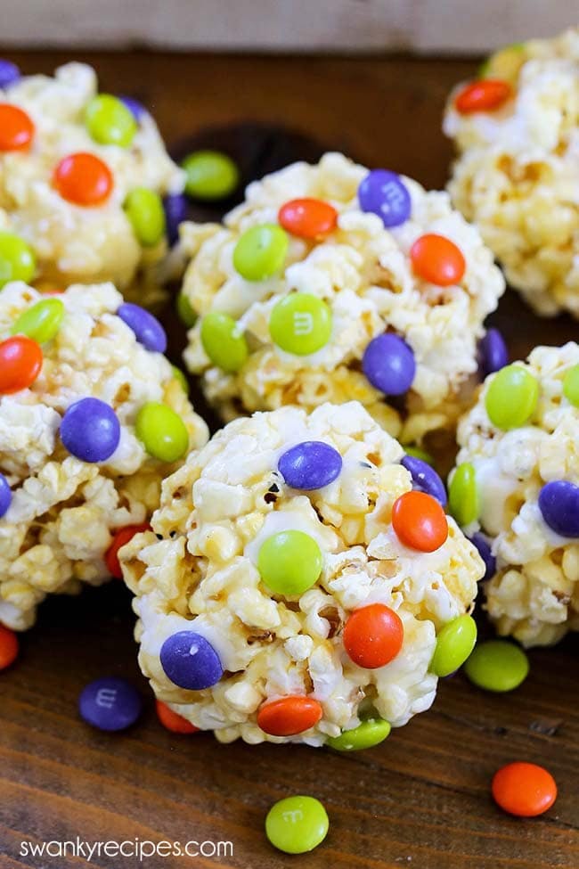 Old Fashioned Popcorn Balls - Classic popcorn balls with Halloween M & Ms. An easy and quick treat to make for the holiday.