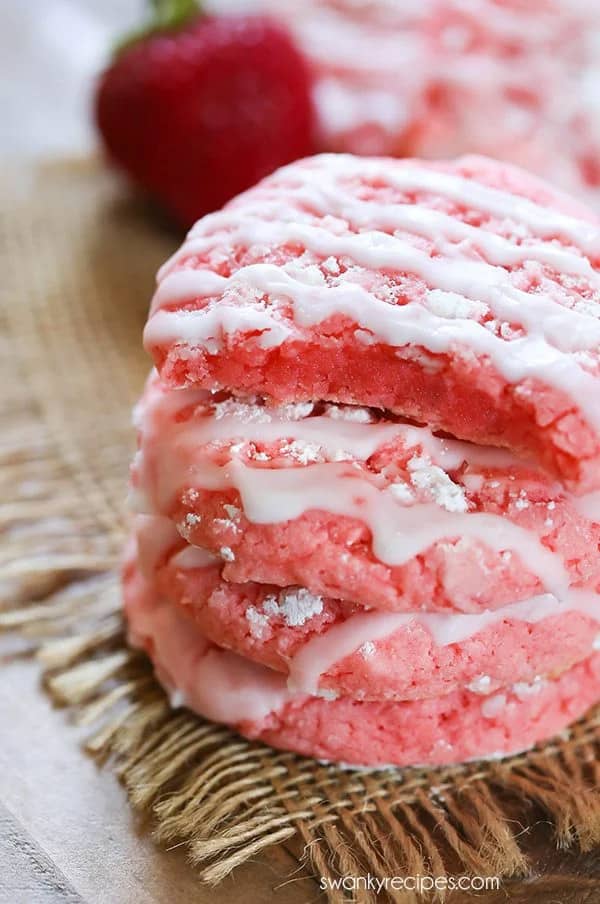 strawberry cookies on a hemp napkin and wood cutting board