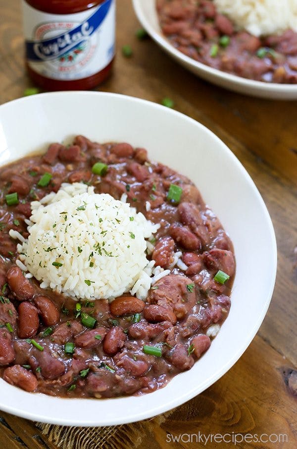 Red Beans and Rice - A taste of the French Quarter. Authentic New Orleans Red Beans and Rice made with Andouille Sausage, ham, Creole seasoning, and rice. This Red Beans and Rice recipe is authentic and the real deal. Do what the locals do and serve this on a Monday!