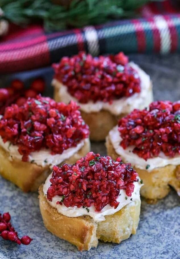 Toasted bruschetta topped with creamy cheese and fresh cranberry relish.