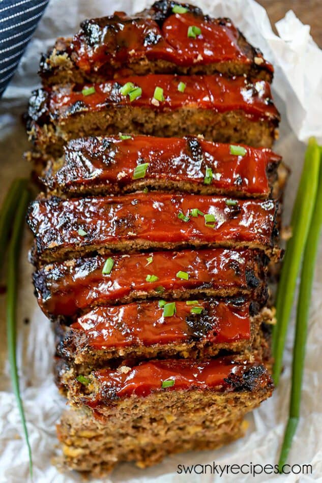 Sliced air fryer meatloaf topped with a glossy ketchup glaze