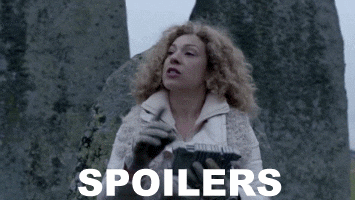 River Song from Doctor Who looks in a notebook, then looks up and shushes someone out of the frame. Caption reads: “SPOILERS"
