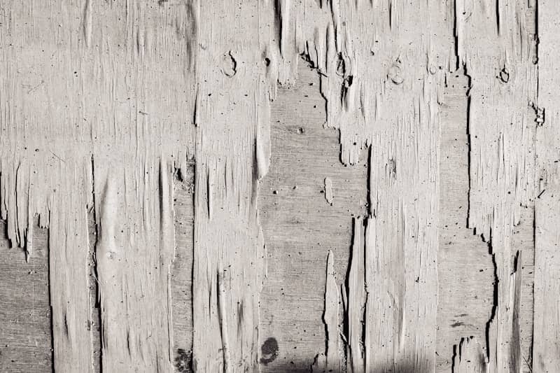 A black and white photo of a wooden wall