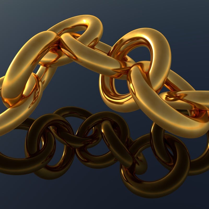 A gold chain is shown on a blue background