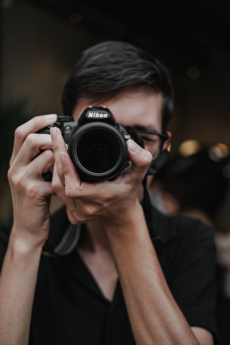 A man taking a picture of himself with a camera