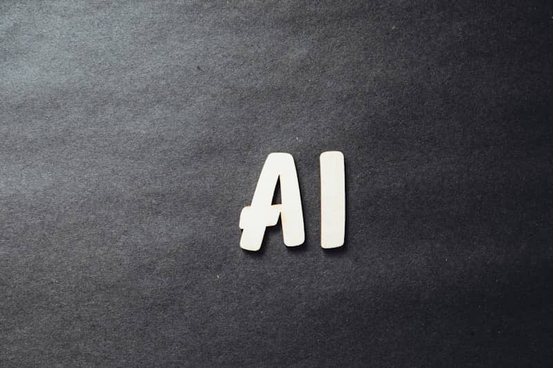 the word ai spelled in white letters on a black surface