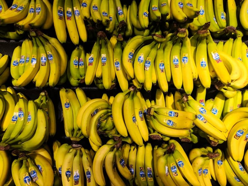 A bunch of bananas are stacked on top of each other