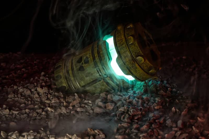 A radioactive barrel is leaking glowing energy.
