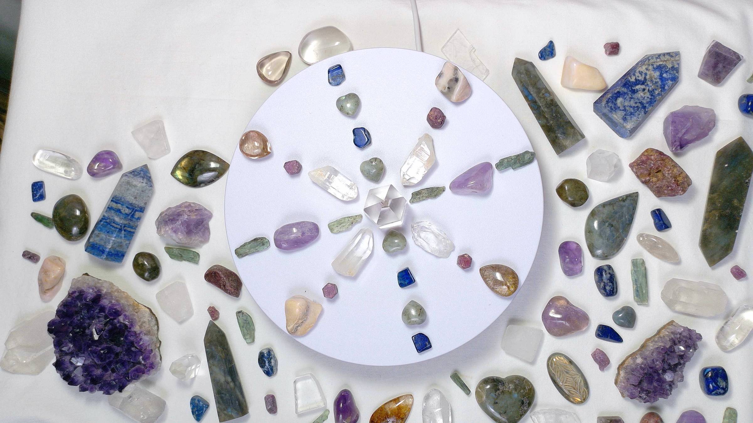 crystals arranged in a circle surrounded by other, larger crystals of various shapes and sizes.