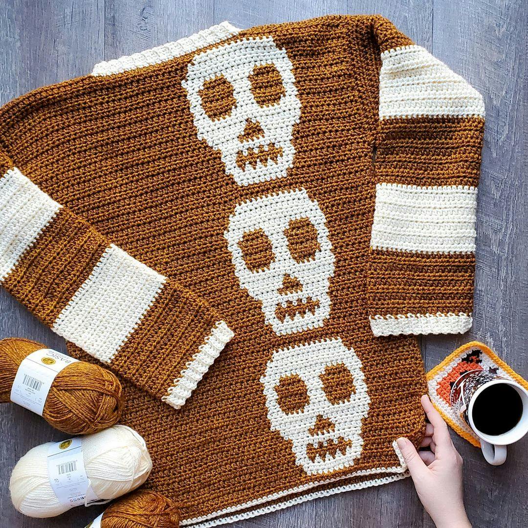 Crochet sweater with skulls down the length of it