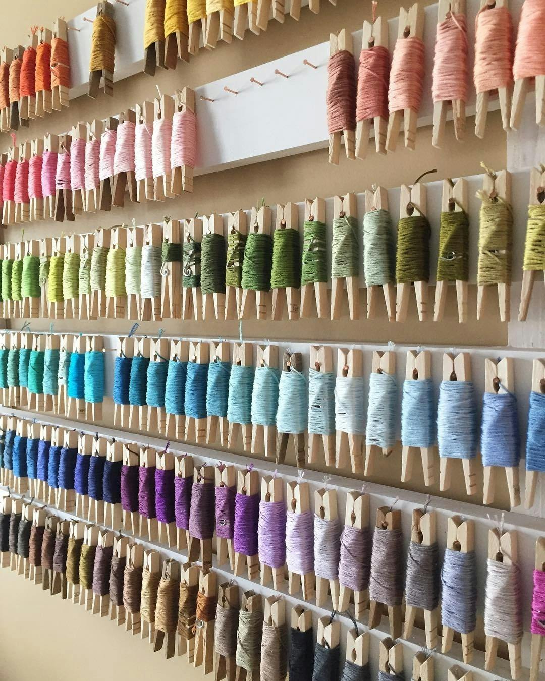 Embroidery floss wrapped around clothes pins