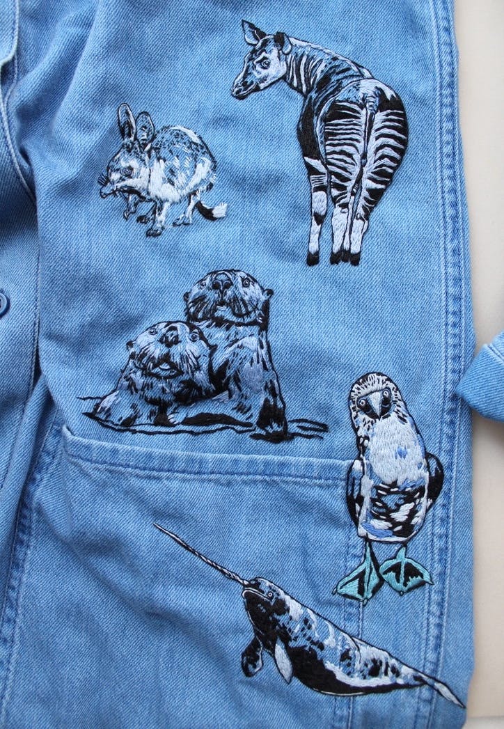 Wild animal embroideries on a denim dress