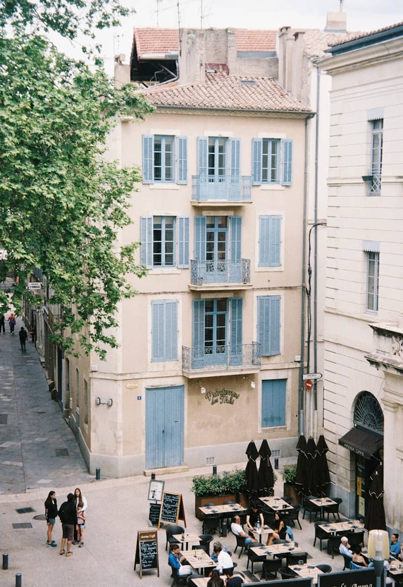 A group of people sitting outside of a building