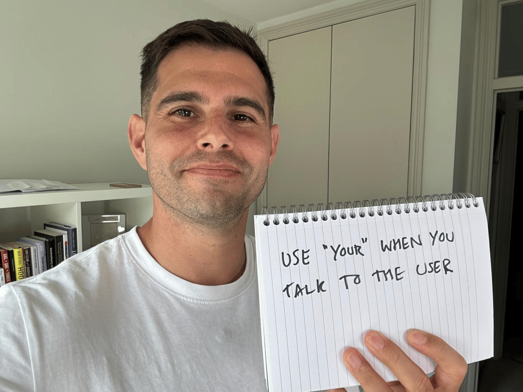 Me holding a sign saying use your when you talk to the user.