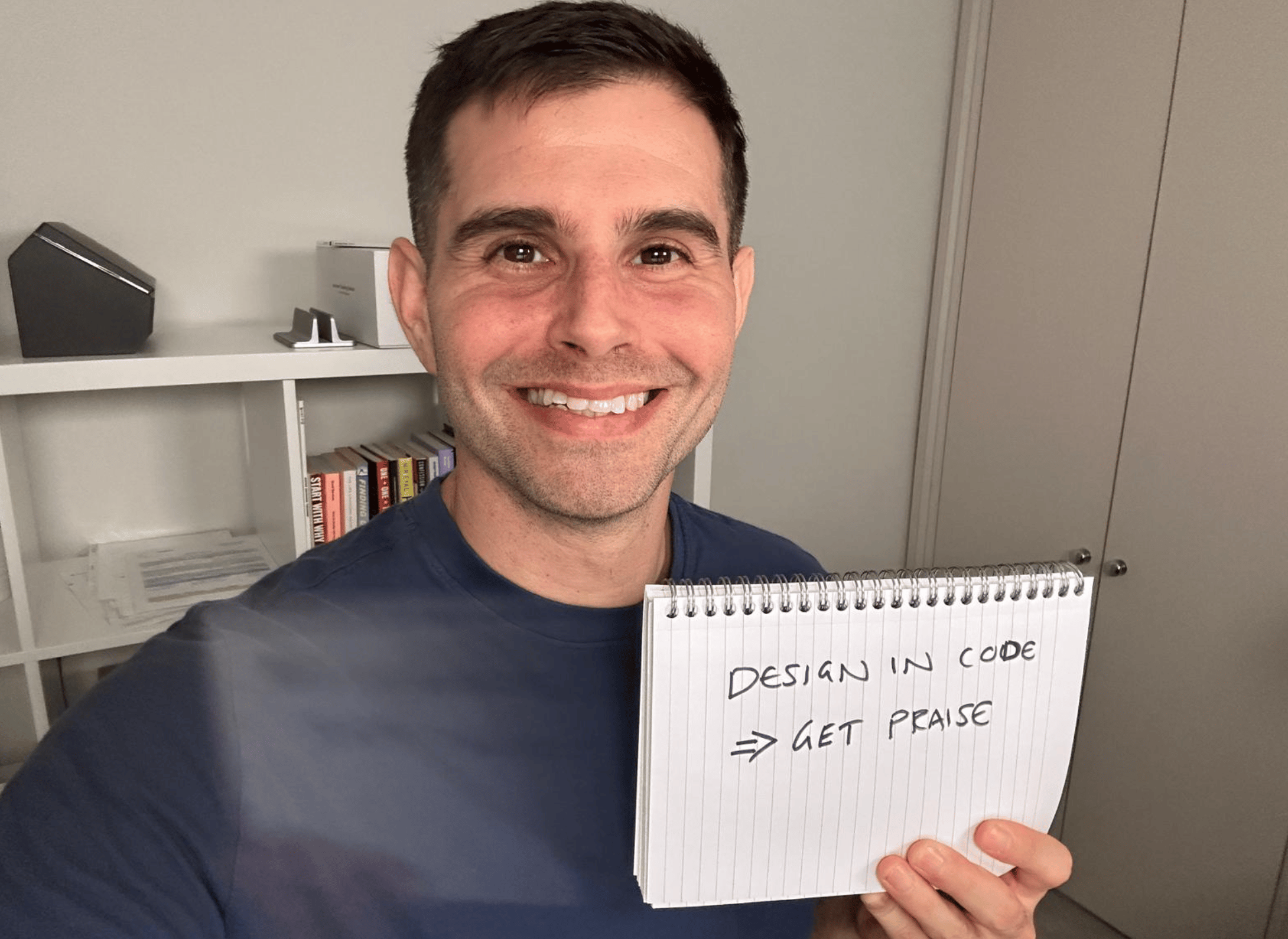 Me holding a sign saying design in code, get praise.