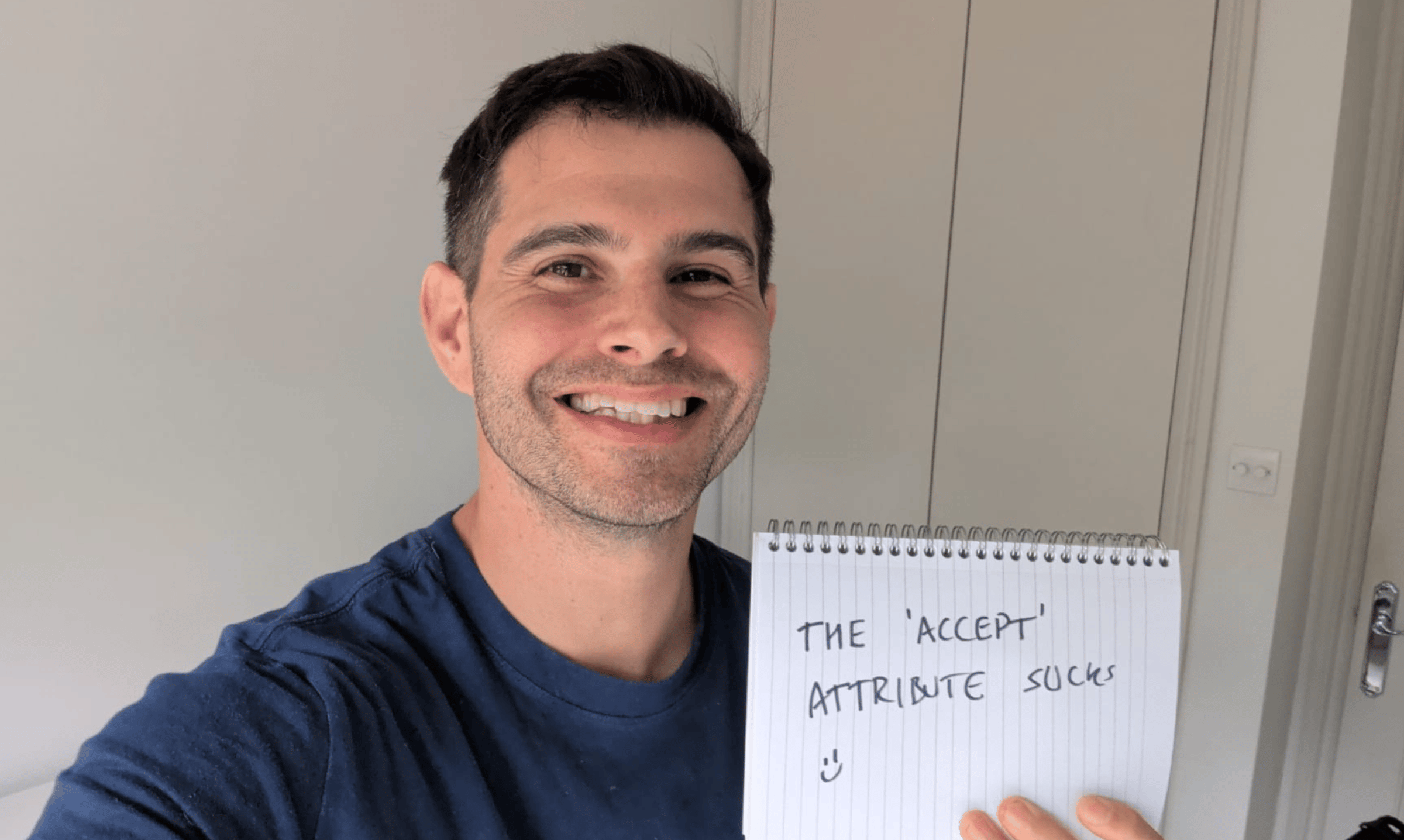 Me holding a sign that says, "the accept attribute sucks"