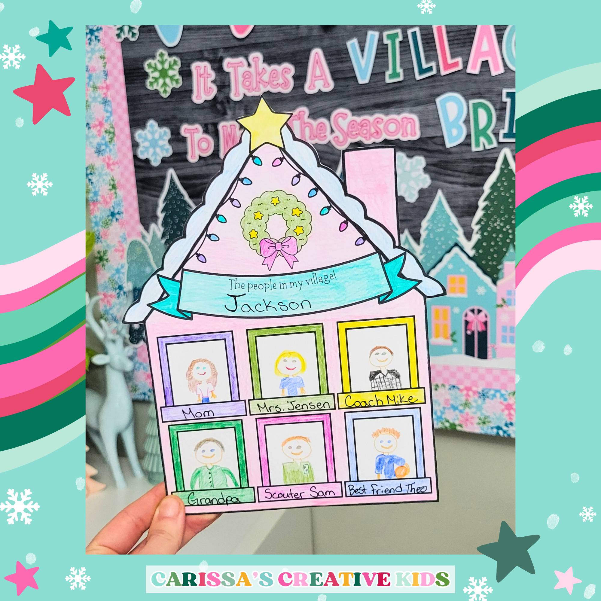 Finished Christmas classroom activity page titled 'The people in my village' with a student’s hand-colored house showing names like Mom, Mrs. Jensen, and Coach Mike. Displayed in front of a holiday classroom bulletin board by Carissa’s Creative Kids.